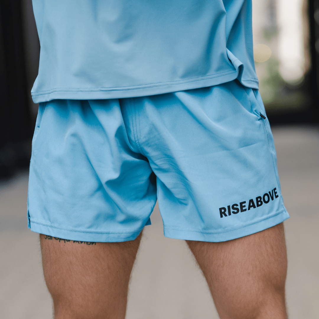 Men’s Valor Performance Shorts featuring lightweight, durable polyester, 4-way stretch, zippered pockets, and an adjustable waistband for ultimate performance and comfort.